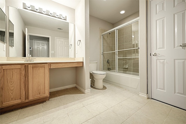 full bathroom featuring toilet, vanity, bath / shower combo with glass door, and tile patterned flooring