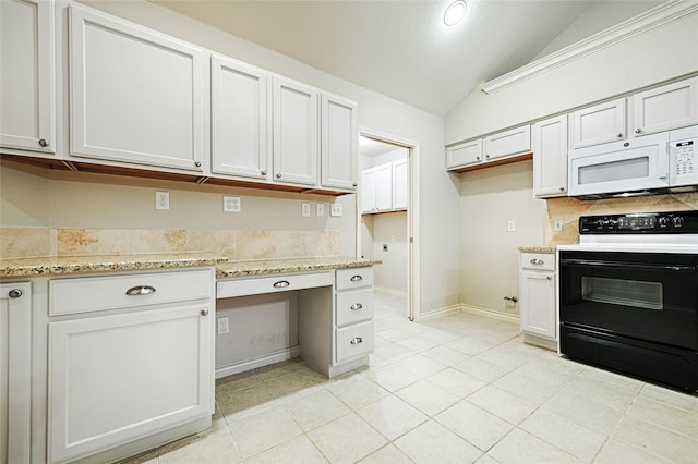 kitchen featuring white cabinetry, electric range, and built in desk