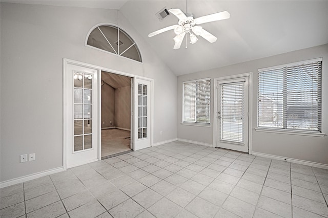 tiled empty room featuring high vaulted ceiling, french doors, and ceiling fan