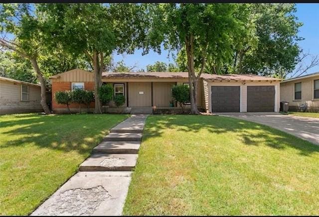 single story home with a garage and a front lawn