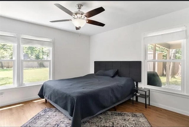 bedroom featuring hardwood / wood-style floors and ceiling fan