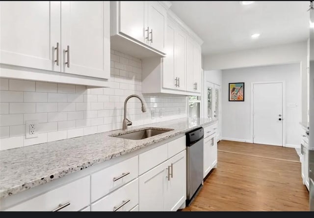 4217 Winfield Ave, Fort Worth, TX 76109 - kitchen featuring a sink, stainless steel dishwasher, white cabinets, tasteful backsplash, and recessed lighting