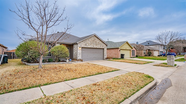 single story home with a garage and a front lawn