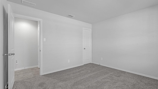 unfurnished room with carpet flooring