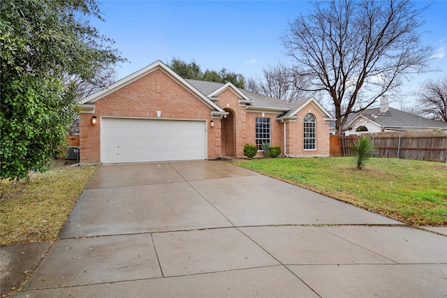 view of front of house with a garage and a front yard