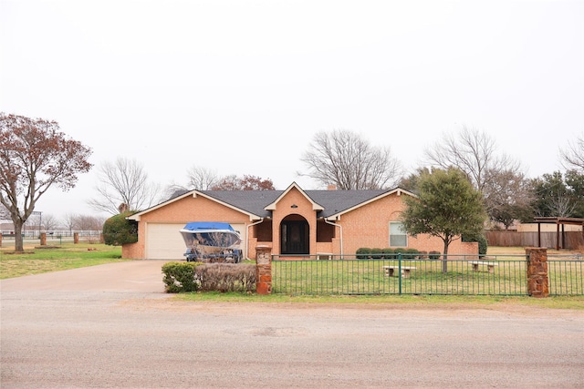 single story home featuring a garage and a front yard