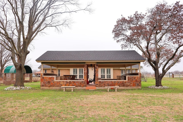 back of house with a lawn