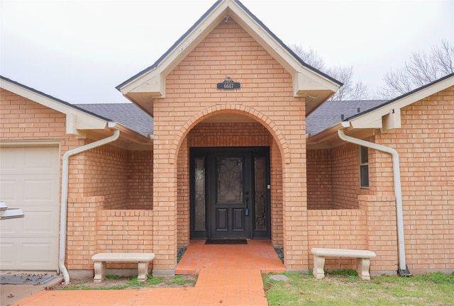 doorway to property featuring a garage