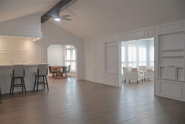 living room with dark wood-type flooring, vaulted ceiling with beams, built in features, and ceiling fan