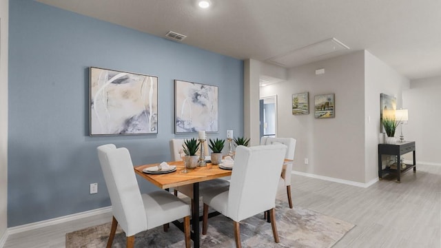 dining room with light hardwood / wood-style flooring