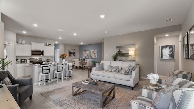 living room featuring light hardwood / wood-style flooring