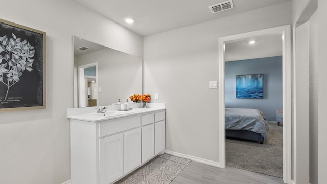 bathroom featuring vanity and wood-type flooring