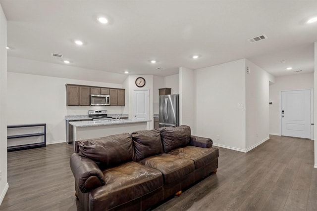 living room with dark wood-type flooring