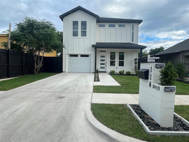 114 W Ohio Ave, Dallas, TX 75224 - view of front facade with board and batten siding, driveway, and an attached garage