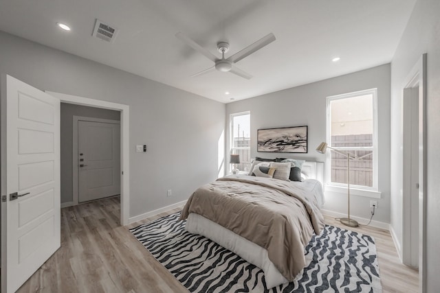 bedroom featuring ceiling fan and light wood-type flooring