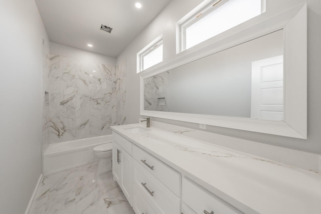 full bathroom with vanity, toilet, and tiled shower / bath