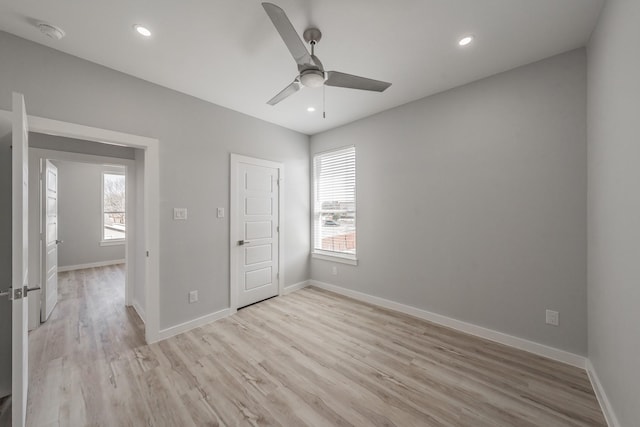 unfurnished bedroom with light hardwood / wood-style flooring and ceiling fan