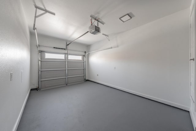 114 W Ohio Ave, Dallas, TX 75224 - garage with a garage door opener and baseboards
