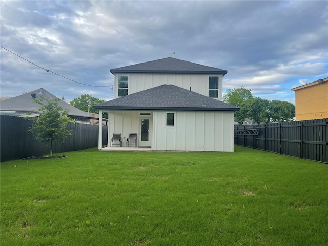 114 W Ohio Ave, Dallas, TX 75224 - rear view of property featuring roof with shingles, board and batten siding, and a patio