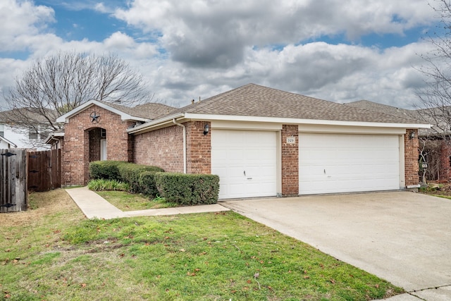 single story home featuring a garage and a front yard