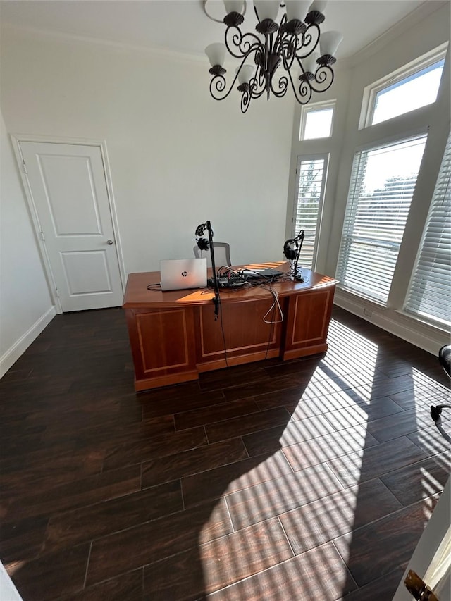 office space featuring ornamental molding and a notable chandelier