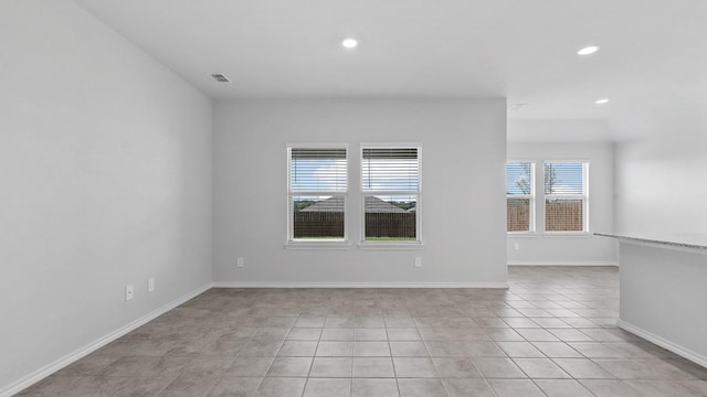 empty room featuring light tile patterned floors