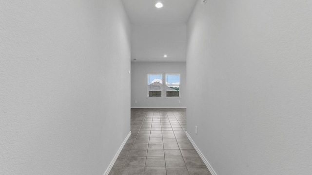 corridor with light tile patterned floors