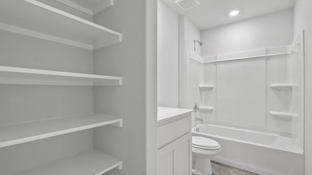 full bathroom featuring vanity, shower / bathtub combination, and toilet