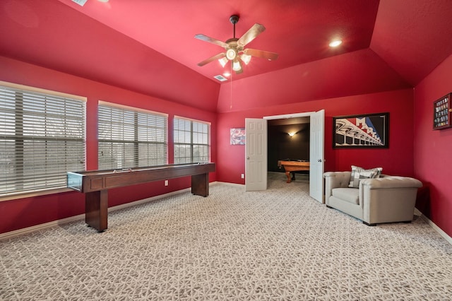 carpeted cinema room with vaulted ceiling and ceiling fan