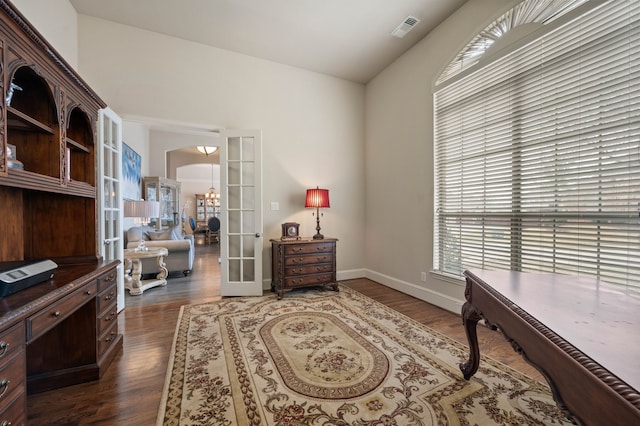 home office featuring dark wood-type flooring and french doors