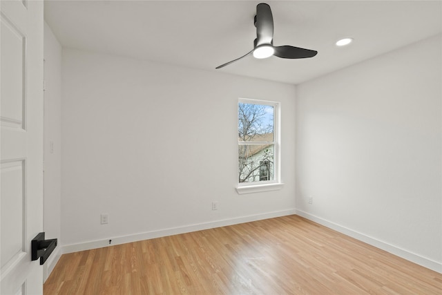 spare room featuring a ceiling fan, recessed lighting, light wood-style flooring, and baseboards