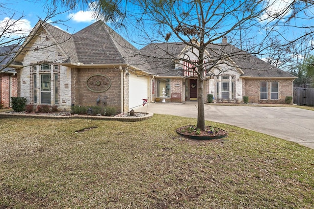 view of front facade featuring a garage and a front lawn