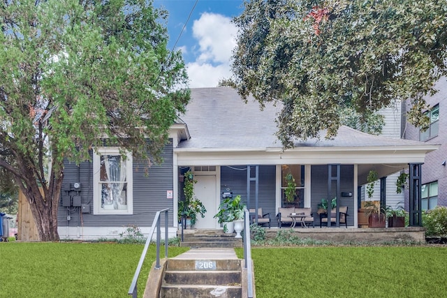 view of front of property with a front lawn and covered porch