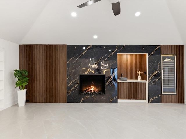 welcome area with ceiling fan and a high end fireplace