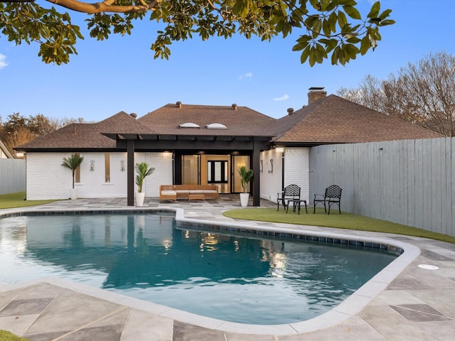 view of pool with outdoor lounge area and a patio area