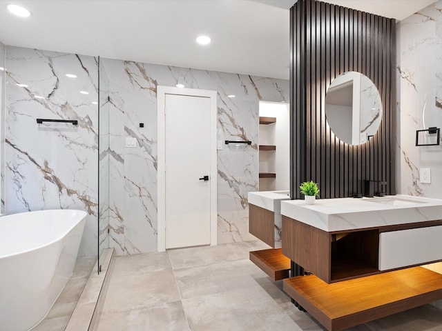 bathroom featuring vanity, tile walls, and separate shower and tub