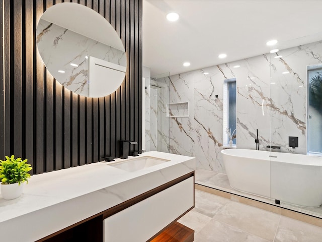 bathroom with vanity, tile walls, and plus walk in shower