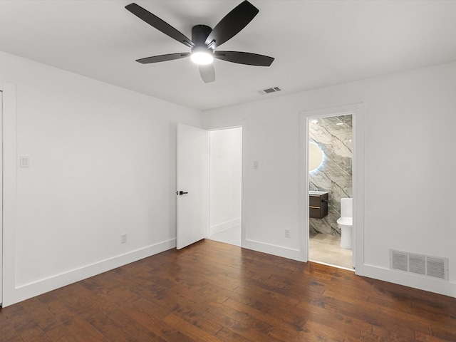 unfurnished room with dark wood-type flooring and ceiling fan