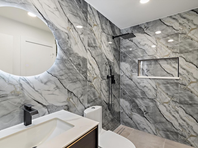 bathroom with vanity, toilet, tile walls, and a tile shower