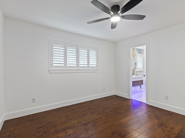 empty room with dark hardwood / wood-style floors and ceiling fan