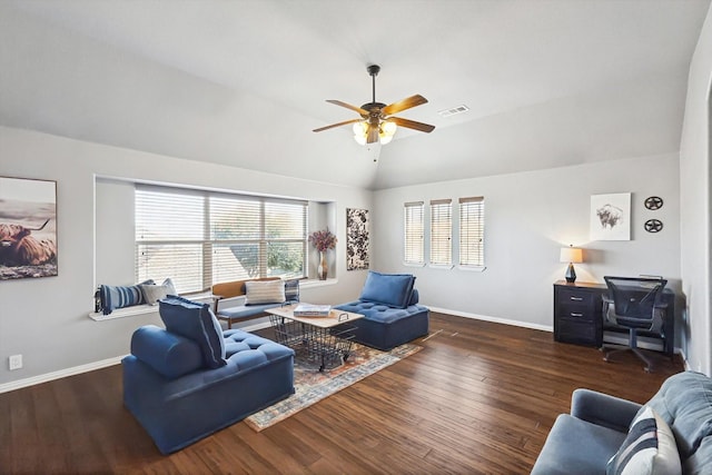 living room with ceiling fan, lofted ceiling, a healthy amount of sunlight, and dark hardwood / wood-style flooring