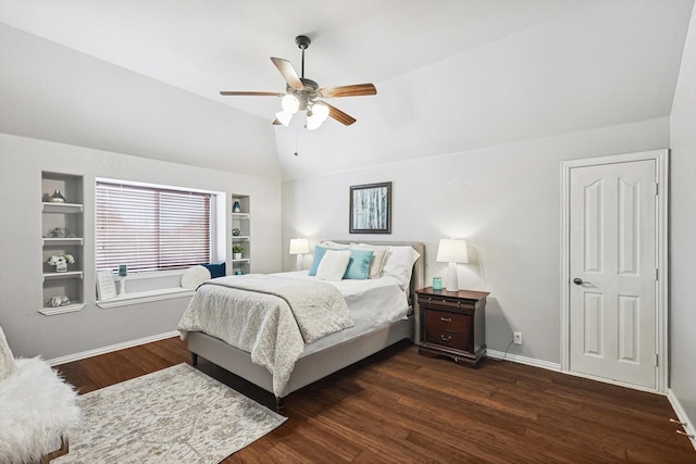 bedroom with dark wood-type flooring, ceiling fan, and vaulted ceiling