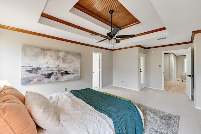 bedroom with wooden ceiling, ornamental molding, a tray ceiling, carpet floors, and ceiling fan