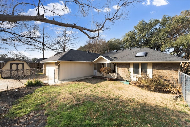 view of front of property with a garage and a front yard