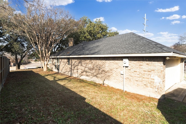 view of property exterior featuring a lawn