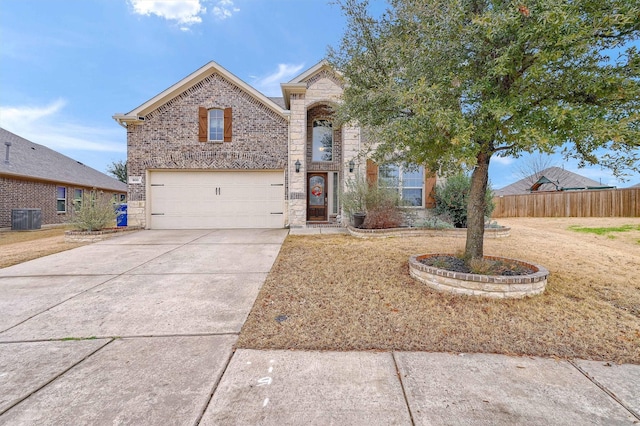 view of front of house featuring concrete driveway, stone siding, fence, central AC, and brick siding