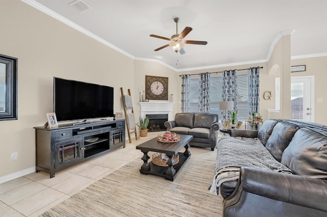 living room featuring crown molding, light tile patterned floors, and ceiling fan