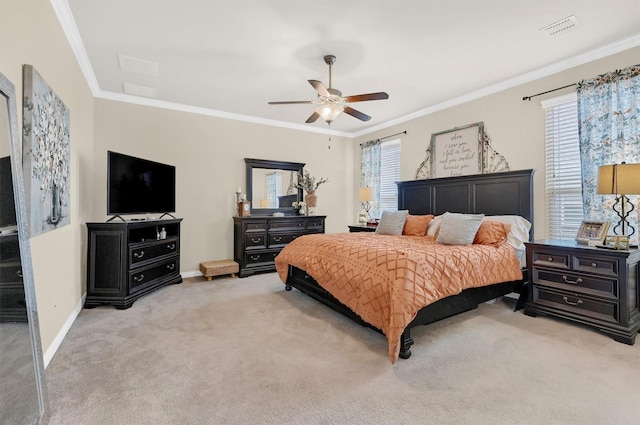 carpeted bedroom featuring crown molding, ceiling fan, and multiple windows