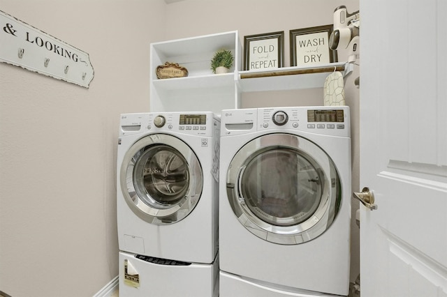 laundry room with washer and dryer