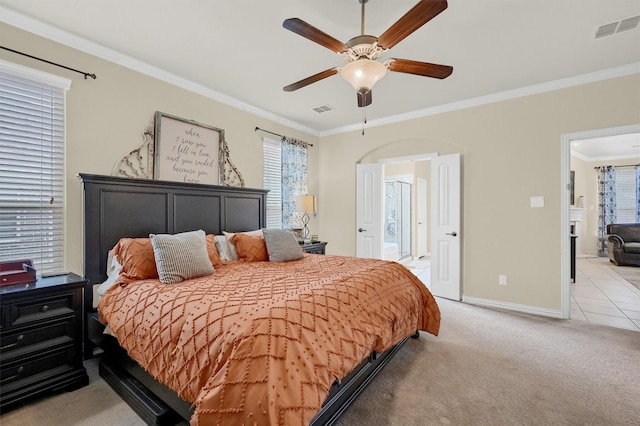 bedroom with crown molding, ceiling fan, and light carpet